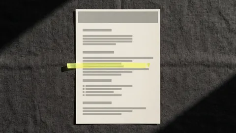 A printed page with a grey header band and one line marked in yellow, like a web page on paper