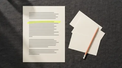 A page with one highlighted line next to three fanned blank index cards and a pencil